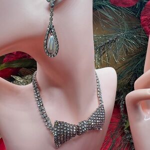 Elegant Silver Bow Necklace with earrings and cuff bracelet.